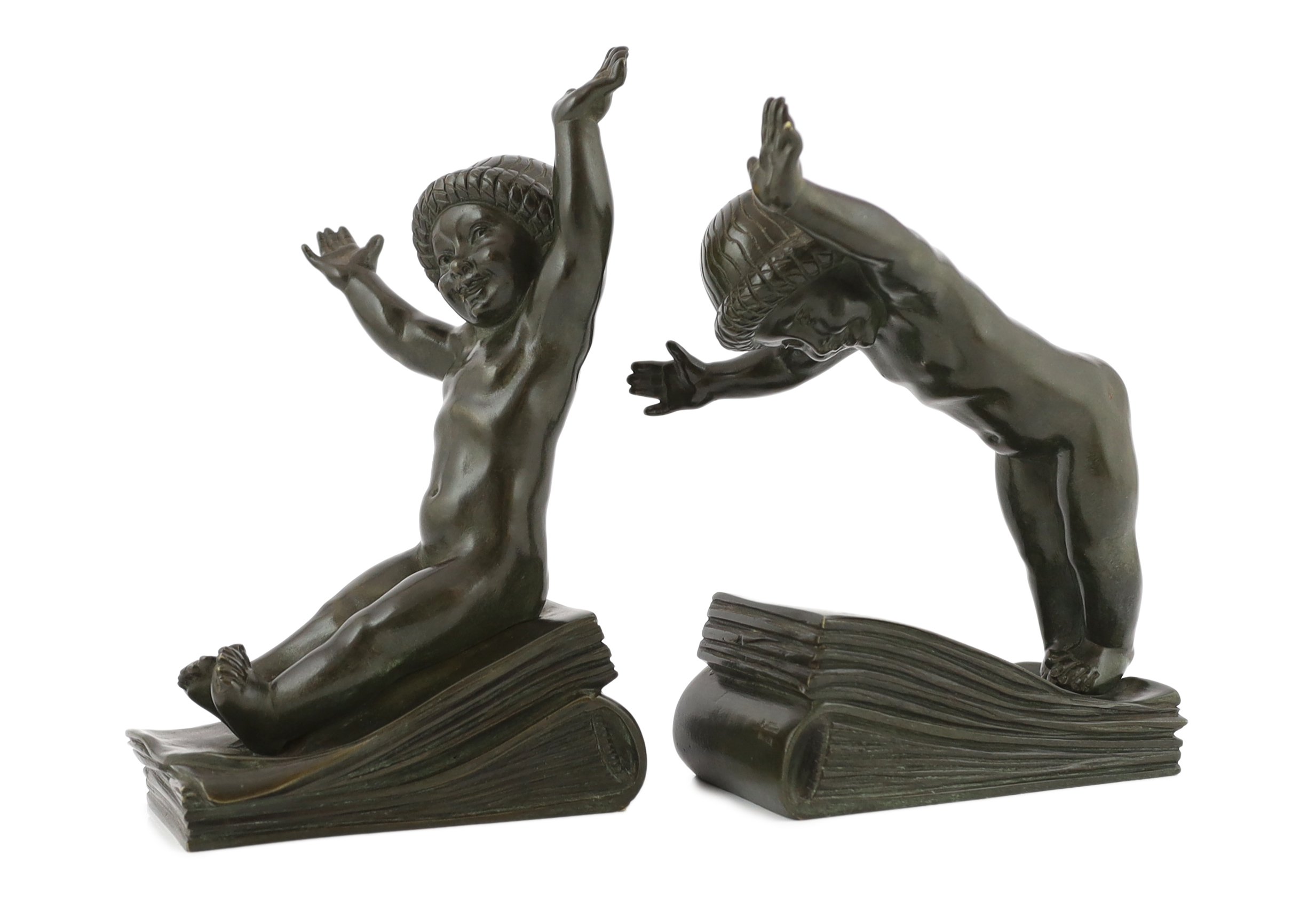 Claude (Claude-Marie Devenet 1851-1931), a pair of French Art Deco bronze bookends, Marcel Guillemard foundry mark, 16cm wide, 25cm high